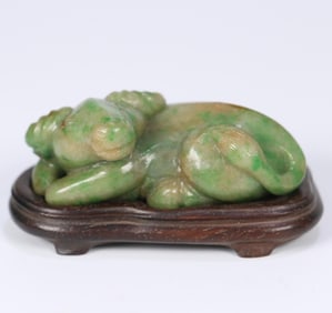 An old jade reclining cow ornament from the Qing Dynasty