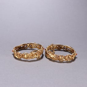 A pair of silver-gilt squirrel grape bracelets from the Qing Dynasty