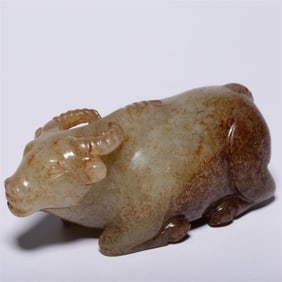 A piece of Hetian jade with a lying cow ornament of the war Han