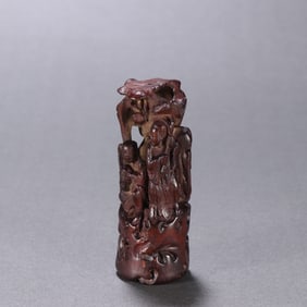 A Qing Dynasty agarwood carving and two immortal ornaments