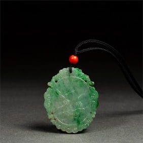 A jadeite-carved bird and flower plaque from the court