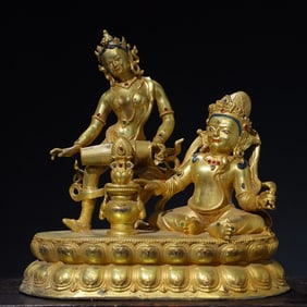 A bronze gilt jeweled Buddha statue