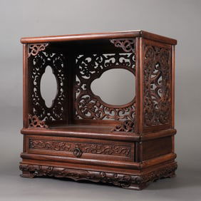 A beautifully carved wood Buddhist shrine