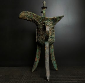 A bronze three-legged cup from the Shang and Zhou dynasties