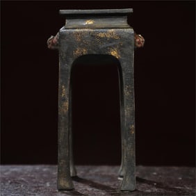 A bronze gold incense burner
