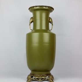 A fine tea glazed bronze elephant head amphora vase