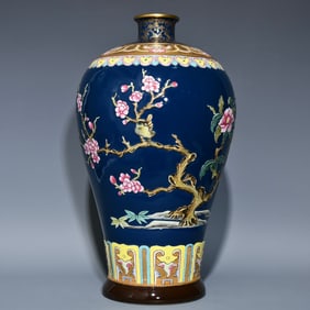 A plum vase made in the Qianlong year of the Qing Dynasty with blue gilt relief pastel flowers and