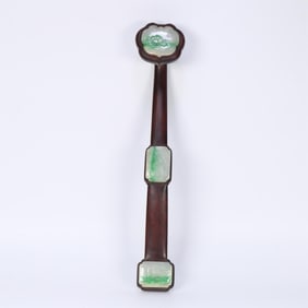 A piece of red sandalwood inlaid with jade flowers and birds in the Qing Dynasty Fulu Ruyi ornaments