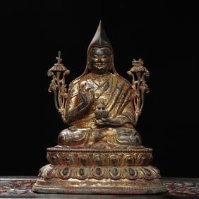 A bronze statue of Tsongkhapa Buddha