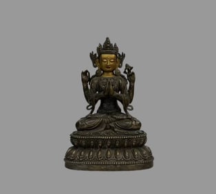 A beautiful copper gilt four-armed Guanyin