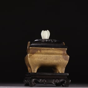 A fine copper-tired four-legged incense burner