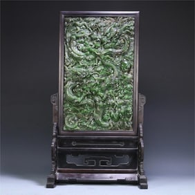 A high-relief three-dragon bead insert from the Qing Dynasty