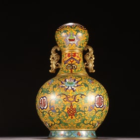 A Qing Dynasty copper tire painting enamel entwined lotus garlic bottle