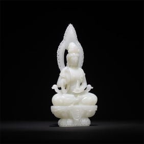A beautiful white jade seated statue of Guanyin