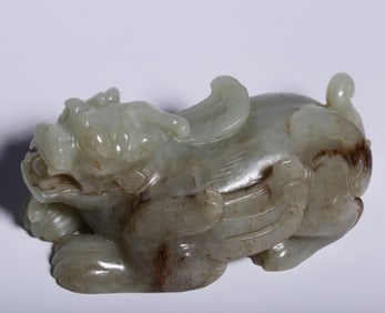 A piece of Hetian white jade from the Qing Dynasty with a Qintian Lu auspicious beast handle