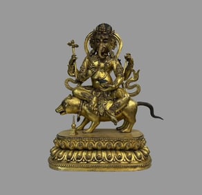 A beautiful copper-gilt elephant trunk god of wealth