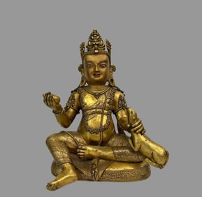 A beautiful copper gilt yellow god of wealth