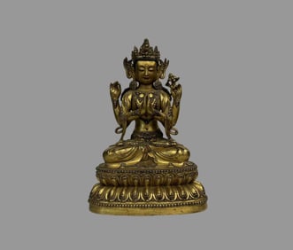 A beautiful copper gilt four-armed Guanyin