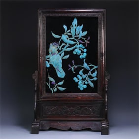 A silver-gilt emerald parrot from the Qing Dynasty is inserted into the screen