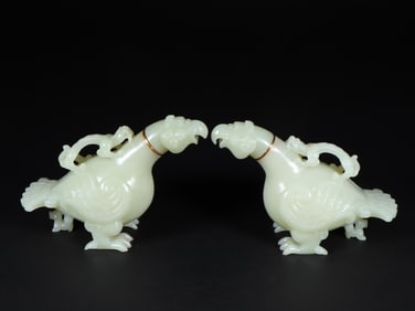 A pair of Hetian jade phoenix bird jars from the Warring Han Dynasty