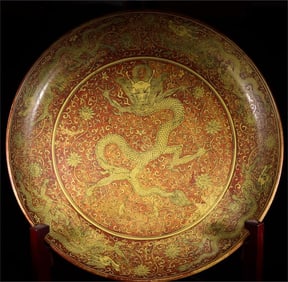 A large plate with a yellow and red dragon pattern made in the Jiajing period of the Ming Dynasty