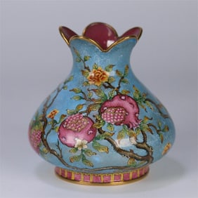 A bronze tire painting enamel pomegranate statue made in the Qianlong period of the Qing Dynasty