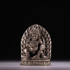 A statue of the God of Wealth in sterling silver