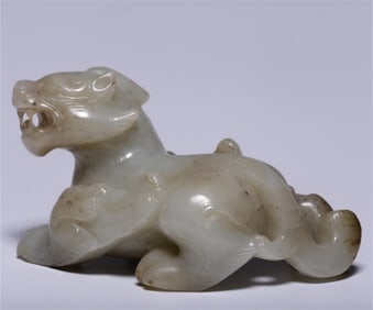 A piece of Hetian white jade from the Qing Dynasty with a Qintian Lu auspicious beast handle