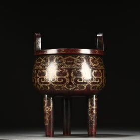 A Qing Dynasty Qianlong year copper pinched silver wire Kui dragon pattern three-legged tripod