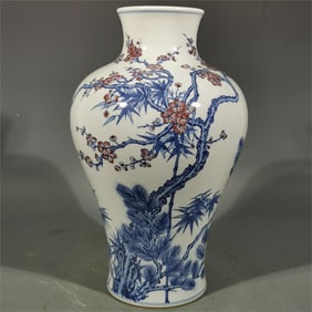 A blue and white glazed red pine bamboo plum bottle made in the Yongzheng era of the Qing Dynasty