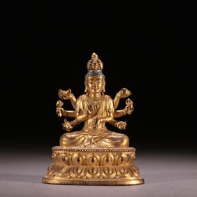 A copper-gilt eight-armed Guanyin from the Qing Dynasty