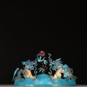A silver-gilt emerald dragon pattern headdress from the Qing Dynasty