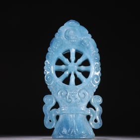 A Qing Dynasty aquamarine Dharma wheel