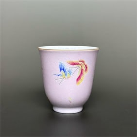 A Qing Dynasty Qianlong era palace powder ground anchovy flower pattern enamel butterfly cup
