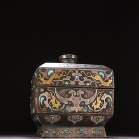 A copper and silver beast pattern lid box of the Han Dynasty