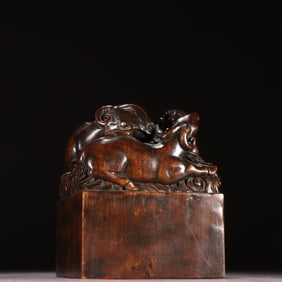 A sandalwood three sheep Kaitai button seal of the Qing Dynasty