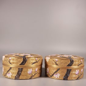A Qing Dynasty Qianlong era enamel carved gold background plum blossom rouge box