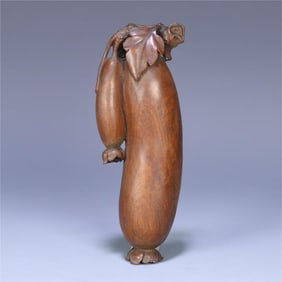 A yellow pear melon ornament from the Qing Dynasty