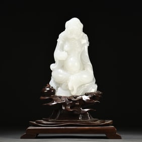 A seated statue of Arhat carved from Hetian white jade in the Qing Dynasty