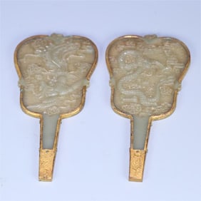 A pair of Liaojin Hetian jade dragon and phoenix pattern banana fans