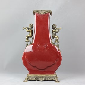 A beautiful red-glazed bronze angel music amphora