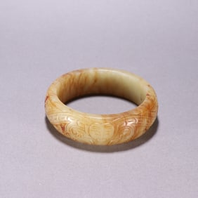 A Ming Dynasty Hetian jade beast face and ear bracelet