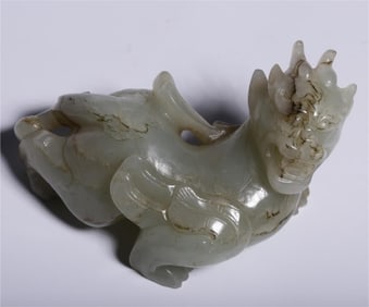 A piece of Hetian white jade from the Qing Dynasty with a Qintian Lu auspicious beast handle