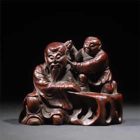 An exquisite bamboo carving boy ear pulling out ornament