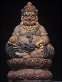 A beautiful old wood carving of the Yellow God of Wealth
