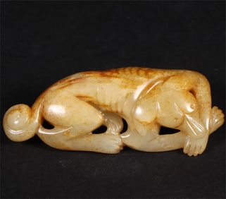 A beautiful old jade reclining dog