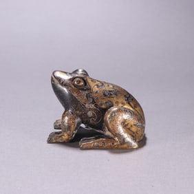 A bronze mistake gold and silver frog from the Han Dynasty