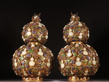 A Qing Dynasty copper gilt inlaid Hetian jade tourmaline "many children and many blessings" gourd