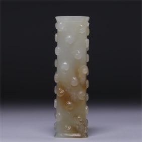 A piece of Hetian white jade from the Qing Dynasty with a drum nail pattern