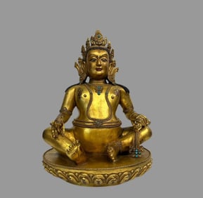 A beautiful copper gilt yellow god of wealth